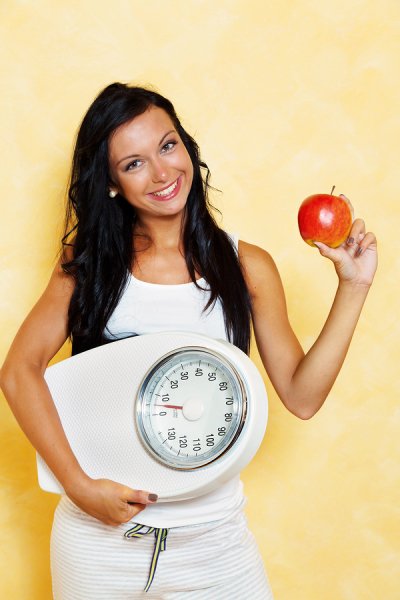 Women with weight calculator and apple